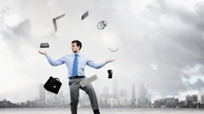 Businessman juggling multiple items