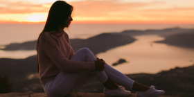 Woman pondering sunset